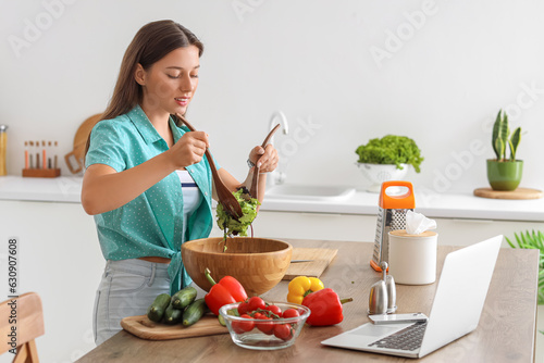 Young woman preparing veget...