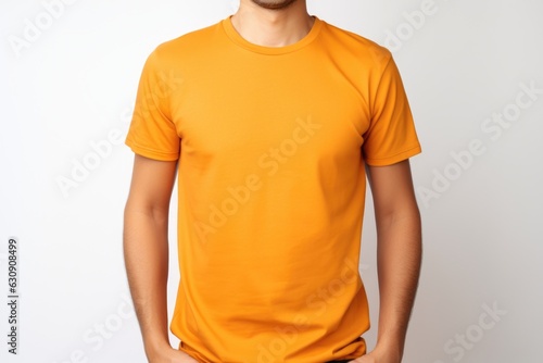 Young man in a orange T-shirt on white background, mock up Generative AI photo