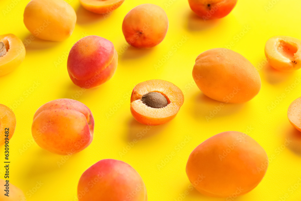 Sweet apricots on yellow background Sweet apricots on yellow background
