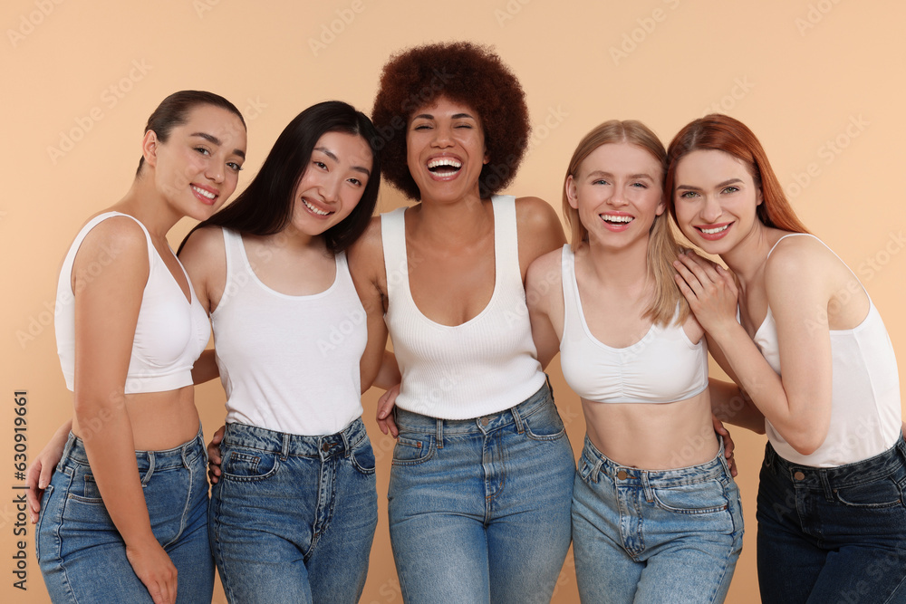 Group of beautiful young women on beige background Group of beautiful young women on beige background