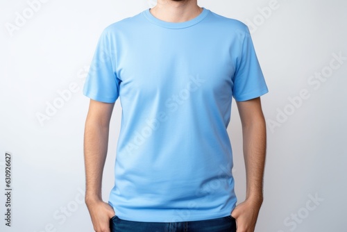 Young man in a blue T-shirt on a white background, mock up Generative AI photo
