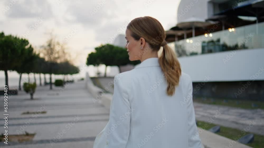 Luxurious girl going street turning around close up. Businesswoman walking town Luxurious girl going street turning around close up. Businesswoman walking town