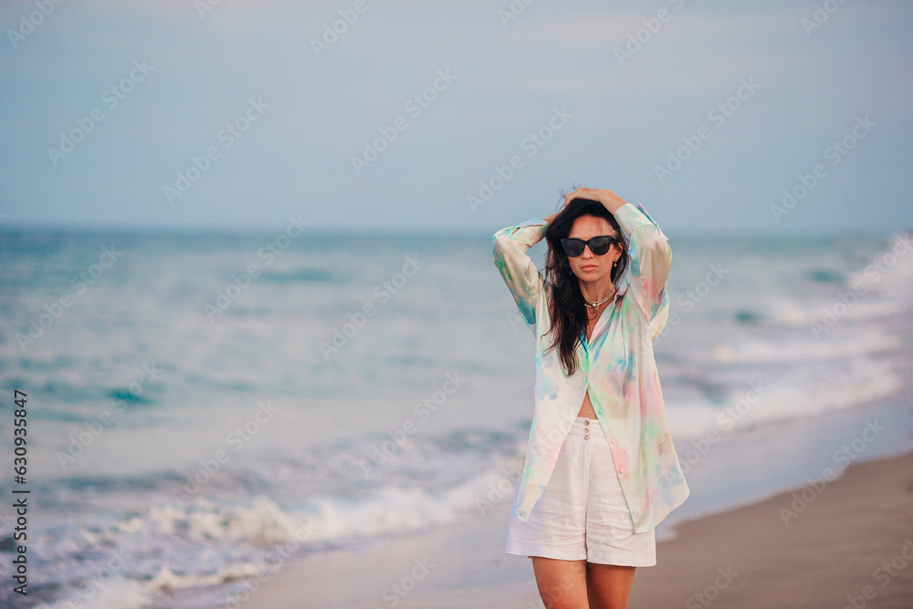 Young beautiful woman on beach vacation on Caribs Young beautiful woman on beach vacation on Caribs