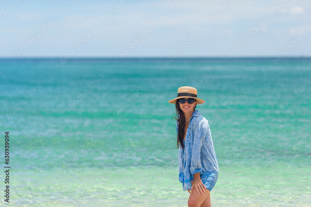 Young beautiful woman on beach vacation on Caribs