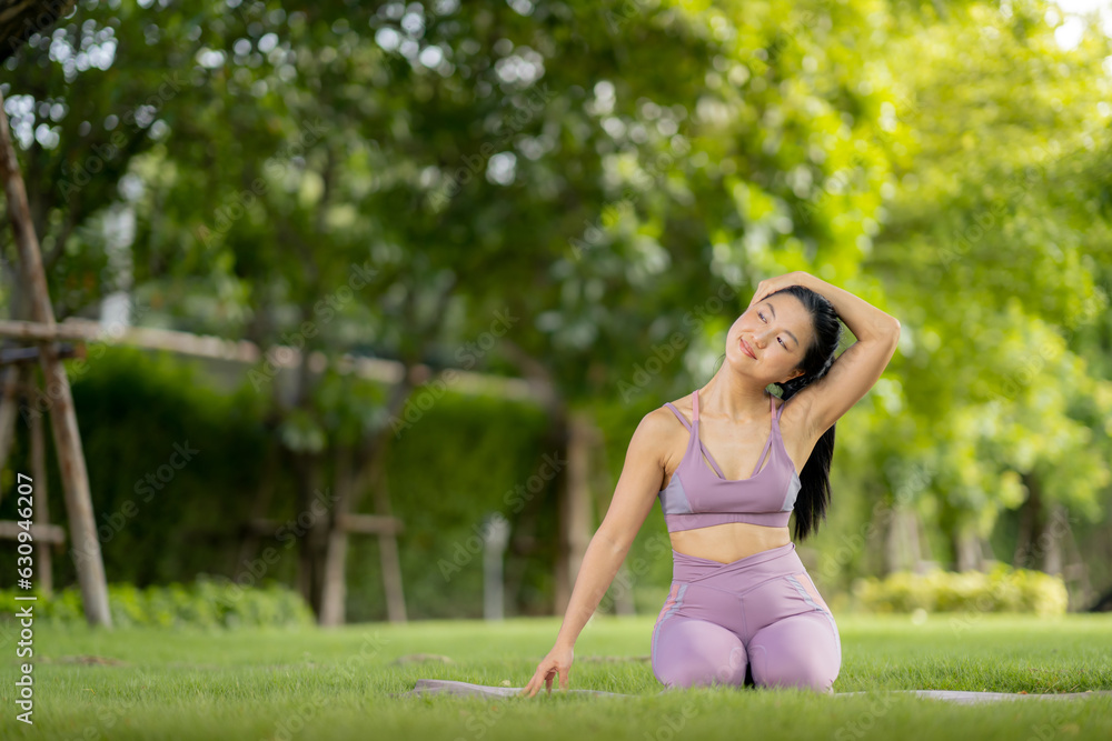 Asian woman wearing yoga clothes doing yoga at her village garden in the morning, happily, Sports healthy lifestyle concepts, Japanese concepts. Asian woman wearing yoga clothes doing yoga at her village garden in the morning, happily, Sports healthy lifestyle concepts, Japanese concepts.