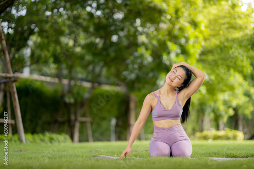 Asian woman wearing yoga clothes doing yoga at her village garden in the morning, happily, Sports healthy lifestyle concepts, Japanese concepts.