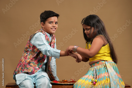 Indian asian cute little kids celebrating Raksha Bandhan,Bhai Dooj