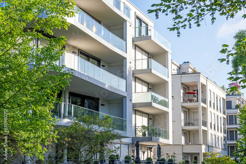 Fototapeta Modern apartment buildings surrounded by greens seen in Berlin, Germany