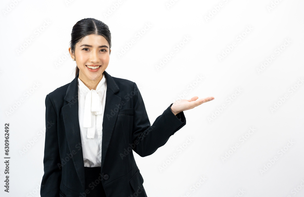 Young asian business woman happy smiling pointing finger to blank space on isolated white background. Female around 25 in suit portrait shot in studio. Young asian business woman happy smiling pointing finger to blank space on isolated white background. Female around 25 in suit portrait shot in studio.