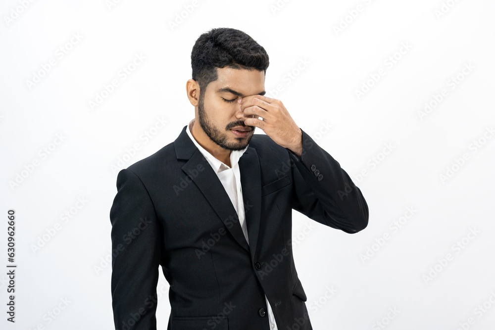 Depressed stressed. Young asian businessman on isolated white background. Angry middle aged Indian businessman in office uniform. Depressed stressed. Young asian businessman on isolated white background. Angry middle aged Indian businessman in office uniform.