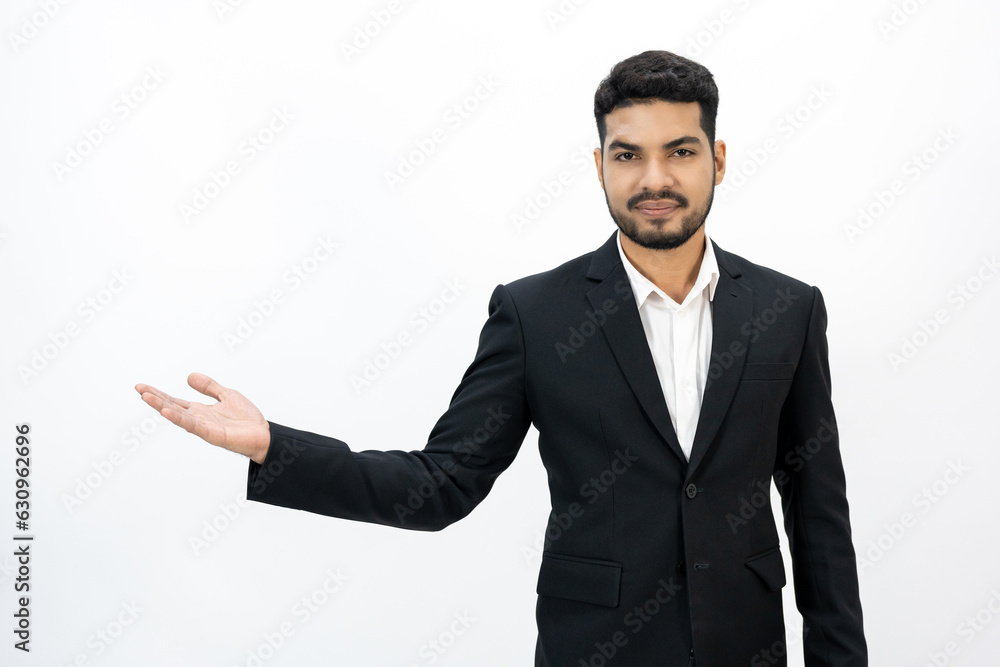 Pointing finger to blank space. Happy Young asian businessman on isolated white background. Handsome businessman in office suit uniform. Pointing finger to blank space. Happy Young asian businessman on isolated white background. Handsome businessman in office suit uniform.