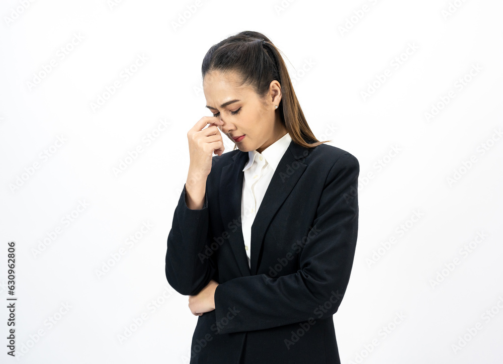 Young asian beautiful business woman hand touching head she's feeling depressed stress headache on isolated tired from working standing on isolated white background she has symptom office syndrome. Young asian beautiful business woman hand touching head she's feeling depressed stress headache on isolated tired from working standing on isolated white background she has symptom office syndrome.