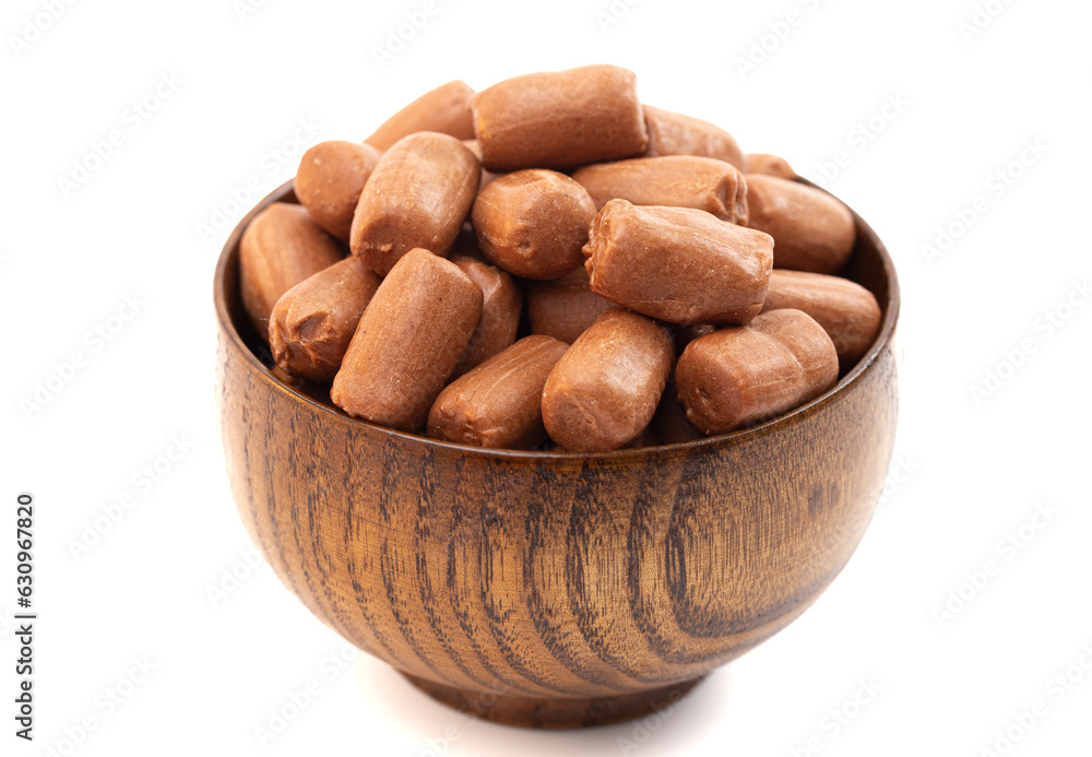 Freeze Dried Brown Chocolate Candy Rolls on a White Background Freeze Dried Brown Chocolate Candy Rolls on a White Background
