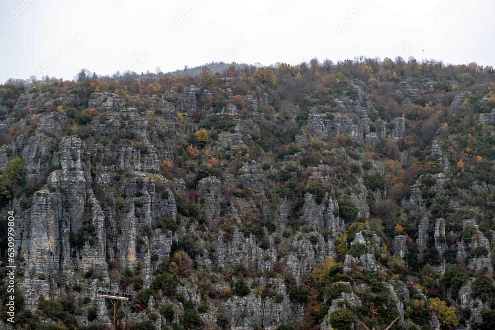 Rocky mountain slope with tree Ioannina Epirus, destination Greece. Geological phenomenon. Rocky mountain slope with tree Ioannina Epirus, destination Greece. Geological phenomenon.