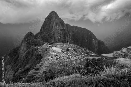 View of Macchu Picchu from the entrance, under a stormy sky