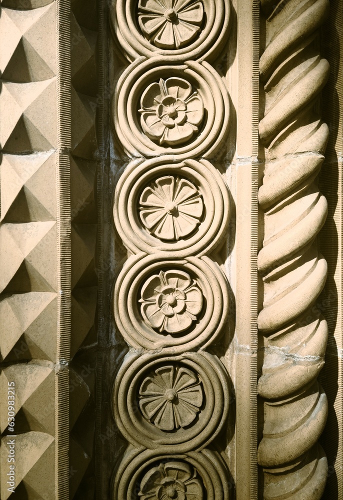 Circular floral stone carvings bordered by pyramids and spirals Circular floral stone carvings bordered by pyramids and spirals