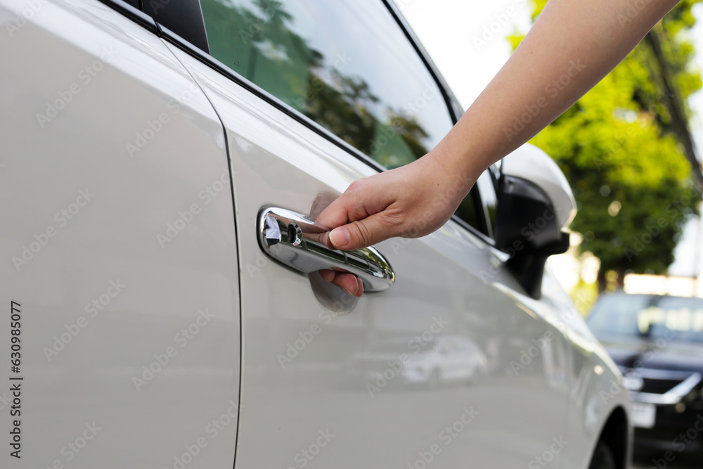 Male hand opening car door Male hand opening car door