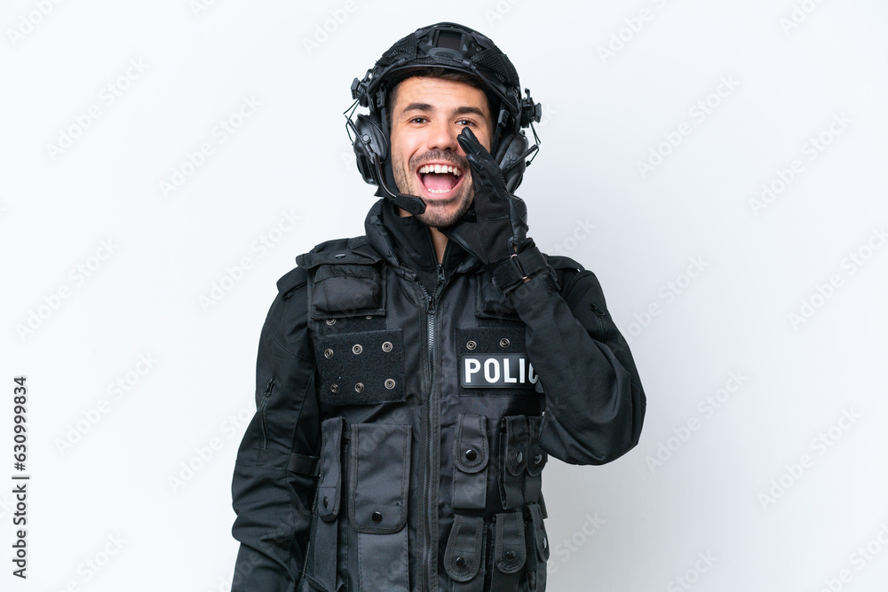 Young caucasian SWAT man isolated on white background shouting with mouth wide open