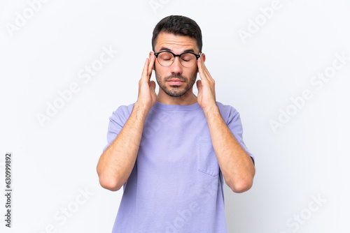 Young caucasian man isolated on white background with headache