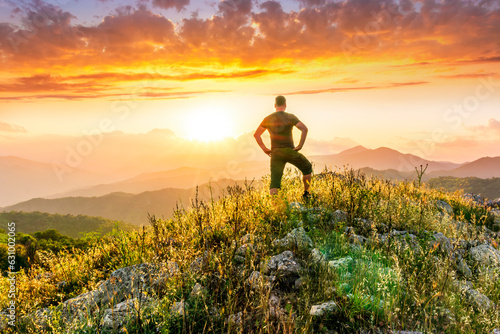 man doing hiking sport in mountains with anazing highland view