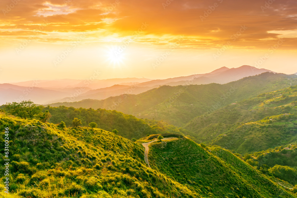 summer scenery mountain view from a highland hill to a beautiful sunset.