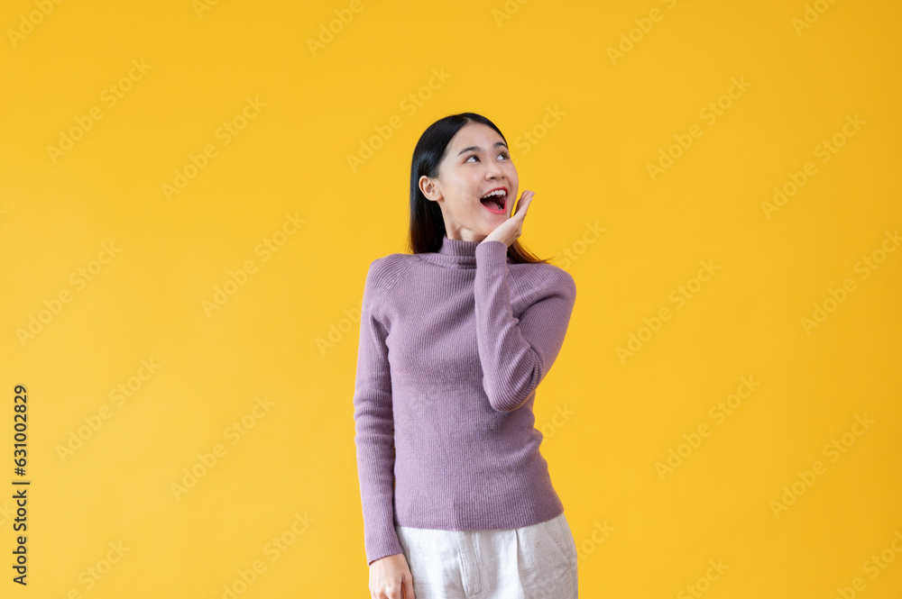 A beautiful Asian woman is looking upwards with a happy face. surprised, amazed, good news A beautiful Asian woman is looking upwards with a happy face. surprised, amazed, good news