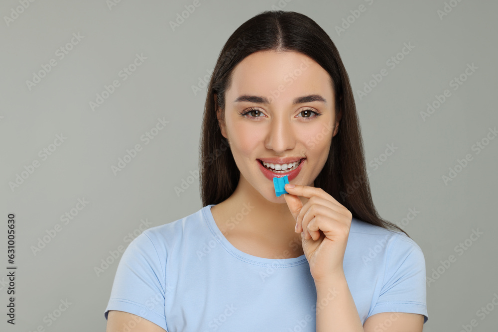 Happy young woman with bubble gum on color background Happy young woman with bubble gum on color background