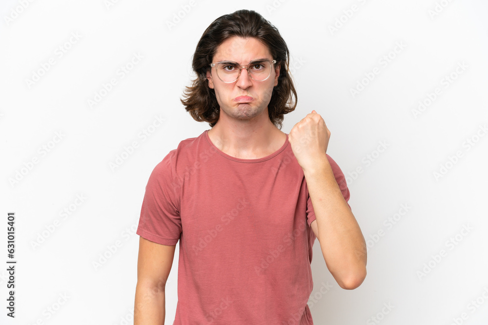 Young handsome man isolated on white background with unhappy expression Young handsome man isolated on white background with unhappy expression