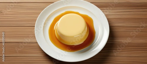 Delicious pudding made with condensed milk displayed on a white plate. Can be viewed from the top  with