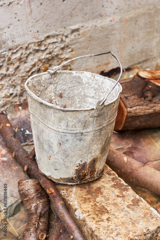 Old dirty metal bucket.