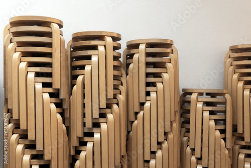 Stacked vintage wooden stools made from bent plywood