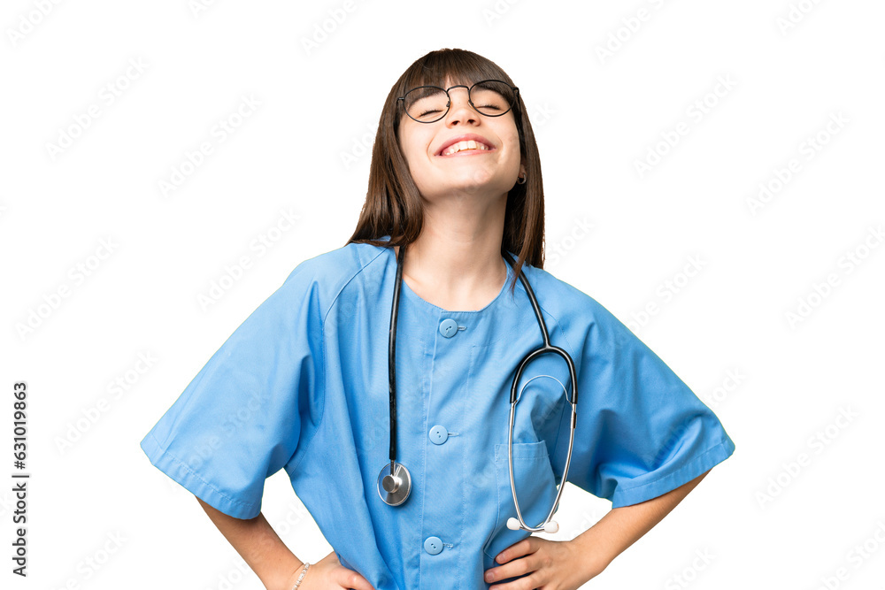 Little girl as a surgeon doctor over isolated chroma key background posing with arms at hip and smiling Little girl as a surgeon doctor over isolated chroma key background posing with arms at hip and smiling