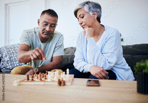 Senior couple, chess match and home with thinking, strategy and mindset for brain power, relax and bonding. Elderly woman, man and sofa with board game, ideas and brainstorming for challenge in house
