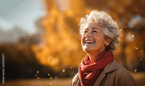 Happy senior fit active woman in the autumn.Portrait of senior woman smiling outdoor. Cheerful old woman in autumn park with copy space. Happy retired lady with grey hair and red beret smiling 