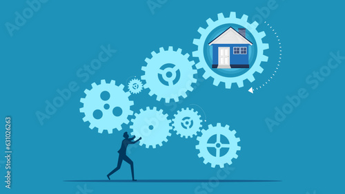 Businessman completes connecting gears to build a house. vector © Nastudio