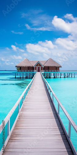 Luxury Maldives tropical island beach resort travel vacation villa. Generative AI image © JoelMasson