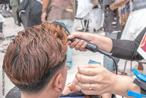 Close-up professional hairdresser using scissors and clippers and accessories for beautiful and decorating men hair Cutting hair for male customer, barbershop fashion and beauty hipster style concept