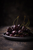 Fresh ripe cherry in dark mood composition