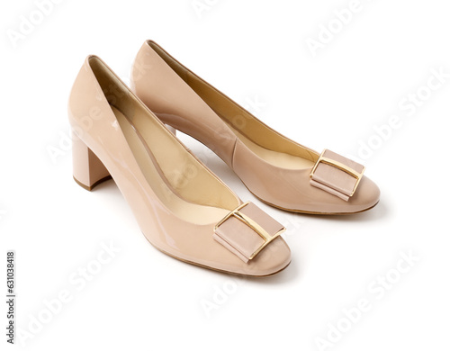 Elegant women's summer leather beige patent leather sandals with heels. A new pair of shoes on a white background.