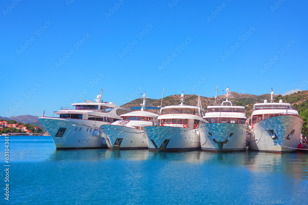Luxury yachts moored in the port . Port of Dubrovnik with expensive yachts