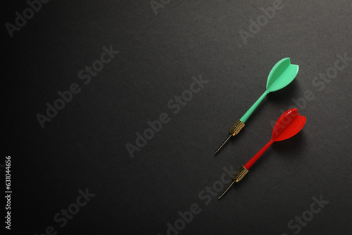Darts for hitting the target on a dark background.