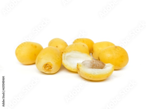 Fresh date palm yellow chemical free placed on a white background.