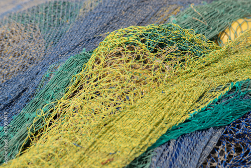 Foto Fishing nets in yellow, aquamarine, green and blue tones