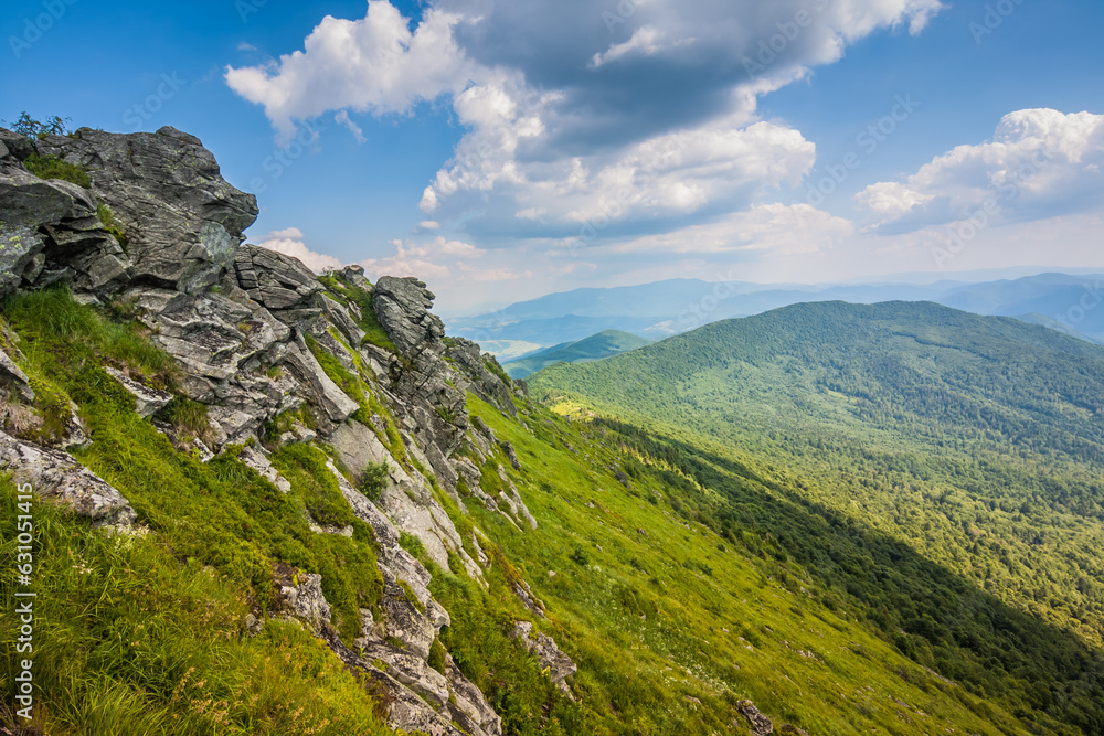 Beautiful view of the Ukrainian mountains Carpathians and valleys.Beautiful green mountains in summer with forests, rocks and grass. Water-making ridge in the Carpathians, Carpathian mountains