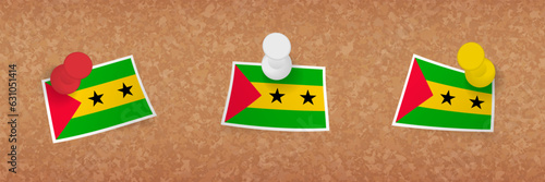 Sao Tome and Principe flag pinned in cork board, three versions of Sao Tome and Principe flag.