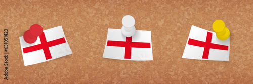 England flag pinned in cork board, three versions of England flag.