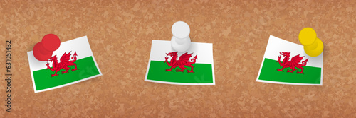 Wales flag pinned in cork board, three versions of Wales flag.