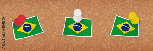 Brazil flag pinned in cork board, three versions of Brazil flag.