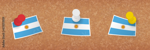 Argentina flag pinned in cork board, three versions of Argentina flag.