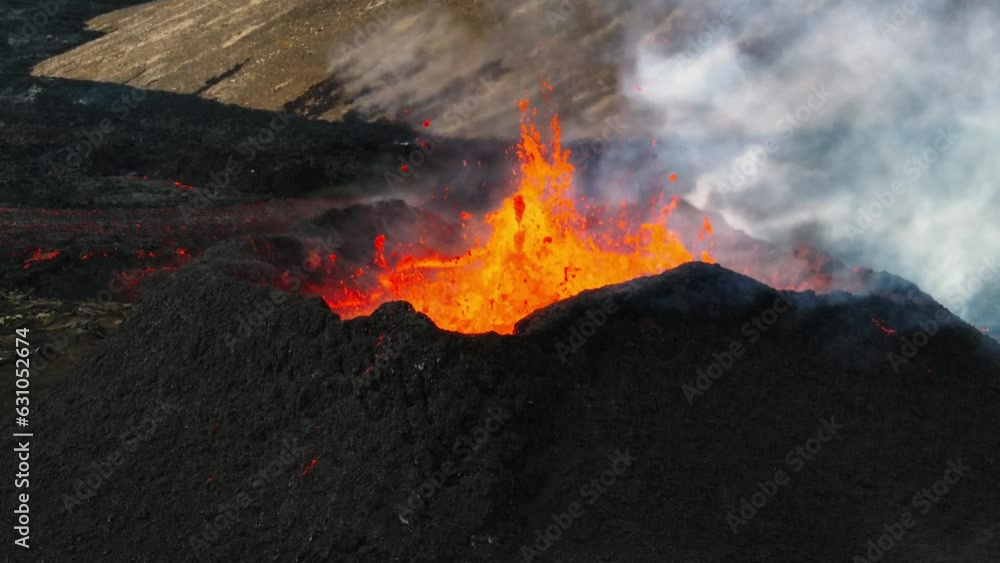 Aerial close up view over the volcanic eruption at Litli-Hrutur, Iceland, with lava and smoke coming out Aerial close up view over the volcanic eruption at Litli-Hrutur, Iceland, with lava and smoke coming out